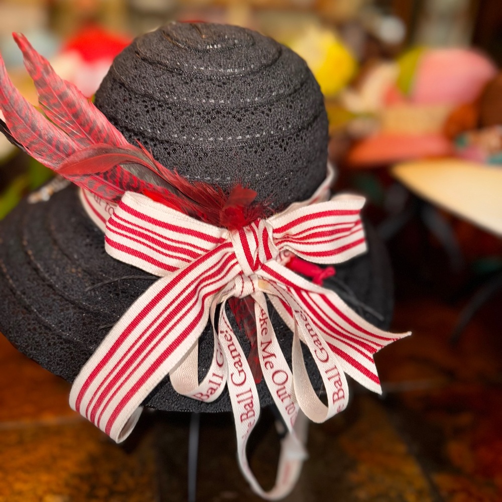 Jane and Berry, black hat with Embellishment Silver Can Tab and Gamecock Feather
